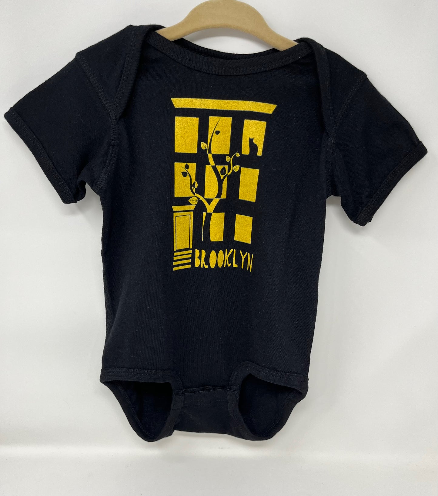 18 M Brownstone Onesie